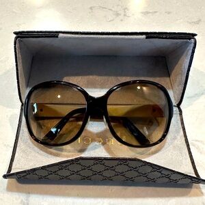 Used Gucci sunglasses with case - women